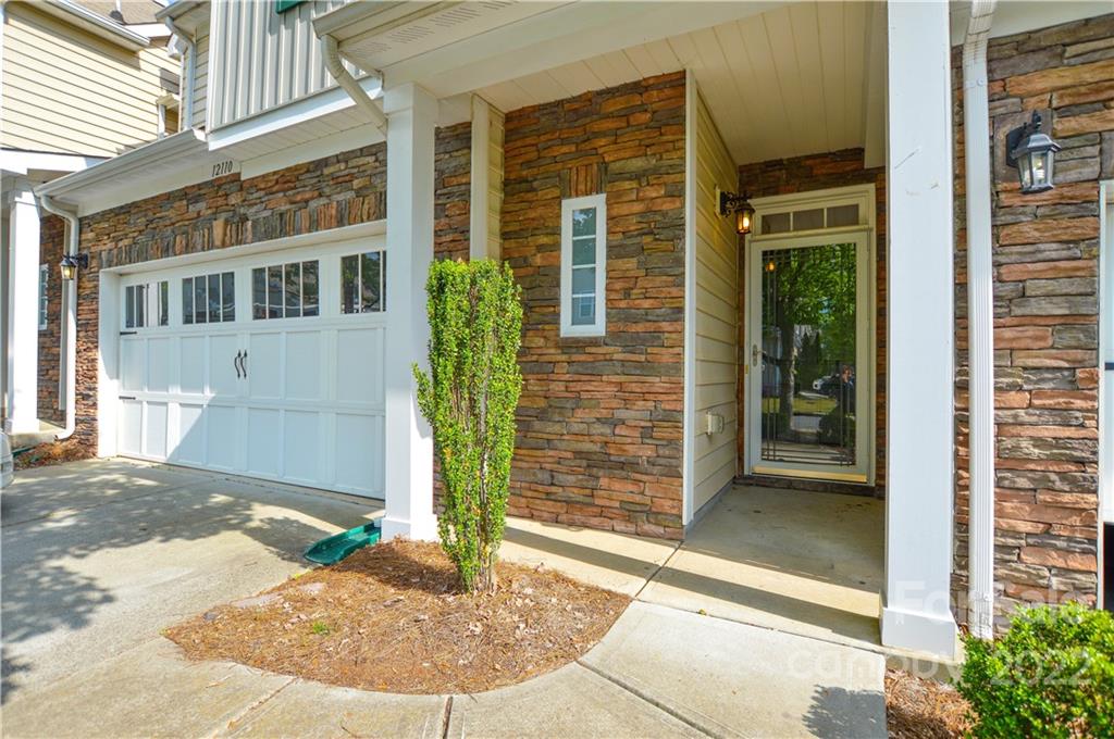 12110 Red Rust Lane Charlotte, NC 28277 - Photo 2 of 36 front view of a brick house with a white door