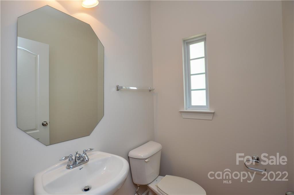 12110 Red Rust Lane Charlotte, NC 28277 - Photo 4 of 36 a bathroom with a sink mirror and toilet