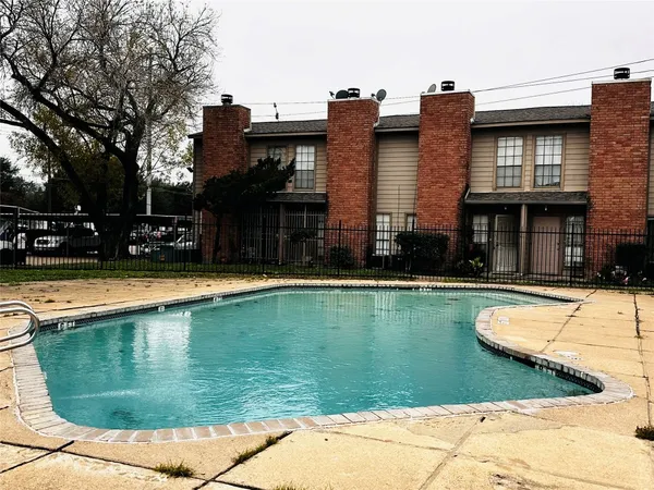 a view of a house with swimming pool