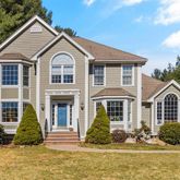 a front view of a house with a yard