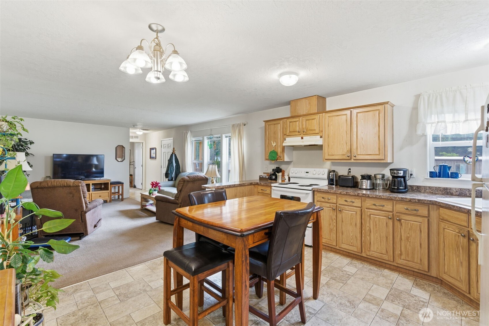 19141 Joselyn Road Southwest Rochester, WA 98579 - Photo 12 of 27 a view of a dining room with furniture and window