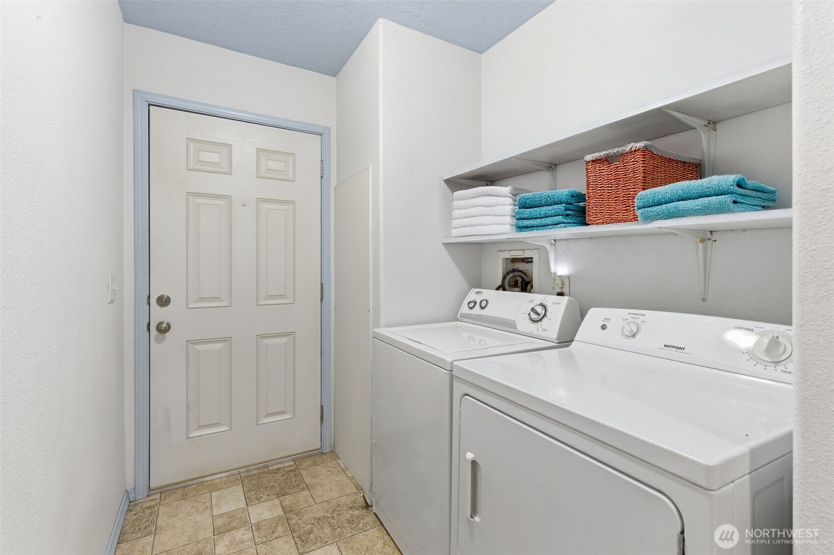 19141 Joselyn Road Southwest Rochester, WA 98579 - Photo 16 of 27 a view of washer and dryer with kitchen in the background