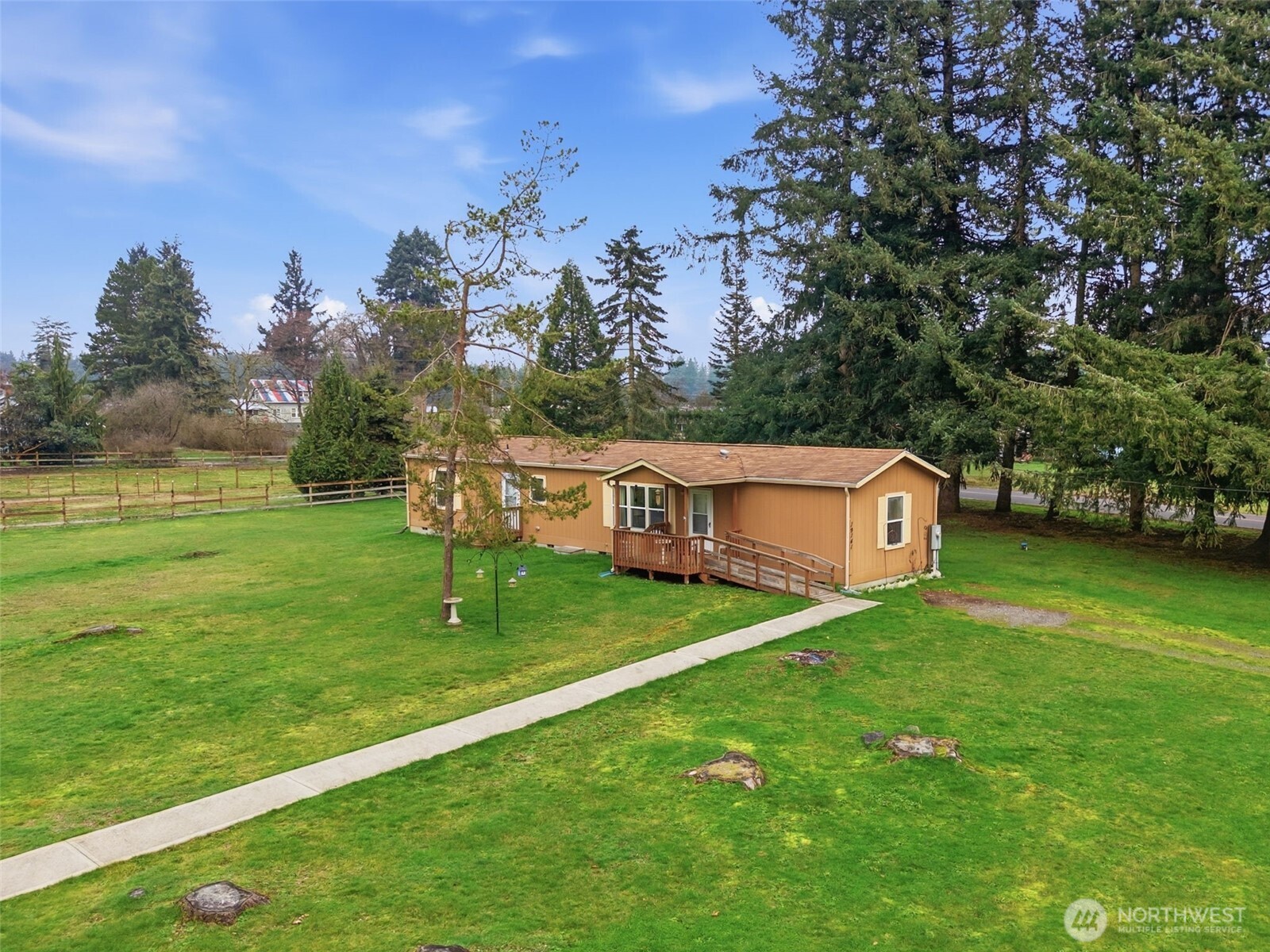 19141 Joselyn Road Southwest Rochester, WA 98579 - Photo 4 of 27 a house view with a garden space
