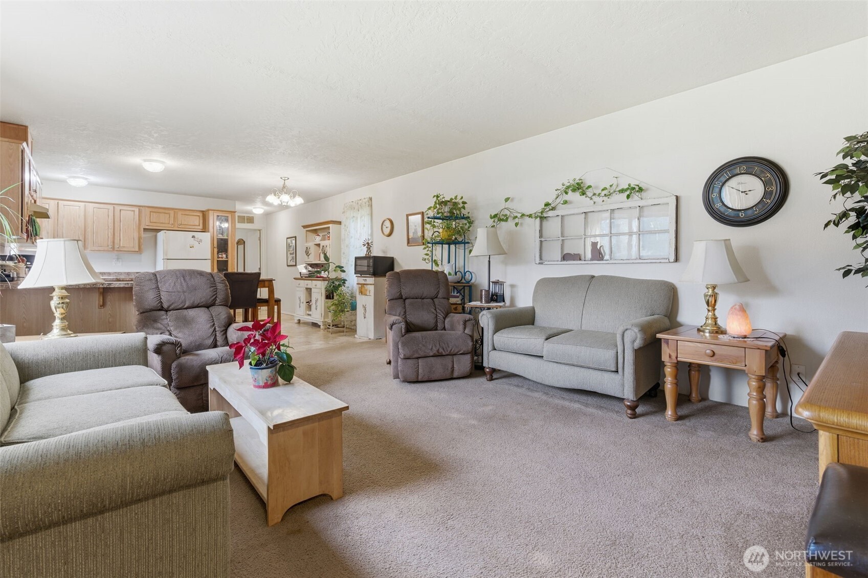 19141 Joselyn Road Southwest Rochester, WA 98579 - Photo 6 of 27 a living room with furniture and a clock