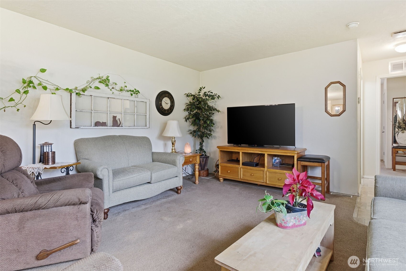 19141 Joselyn Road Southwest Rochester, WA 98579 - Photo 8 of 27 a living room with furniture and a flat screen tv