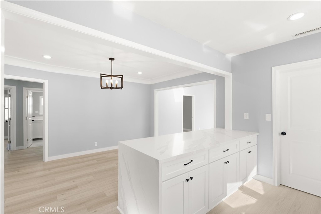 8460 Truxton Avenue Los Angeles, CA 90045 - Photo 11 of 41 wooden floor with white cabinets