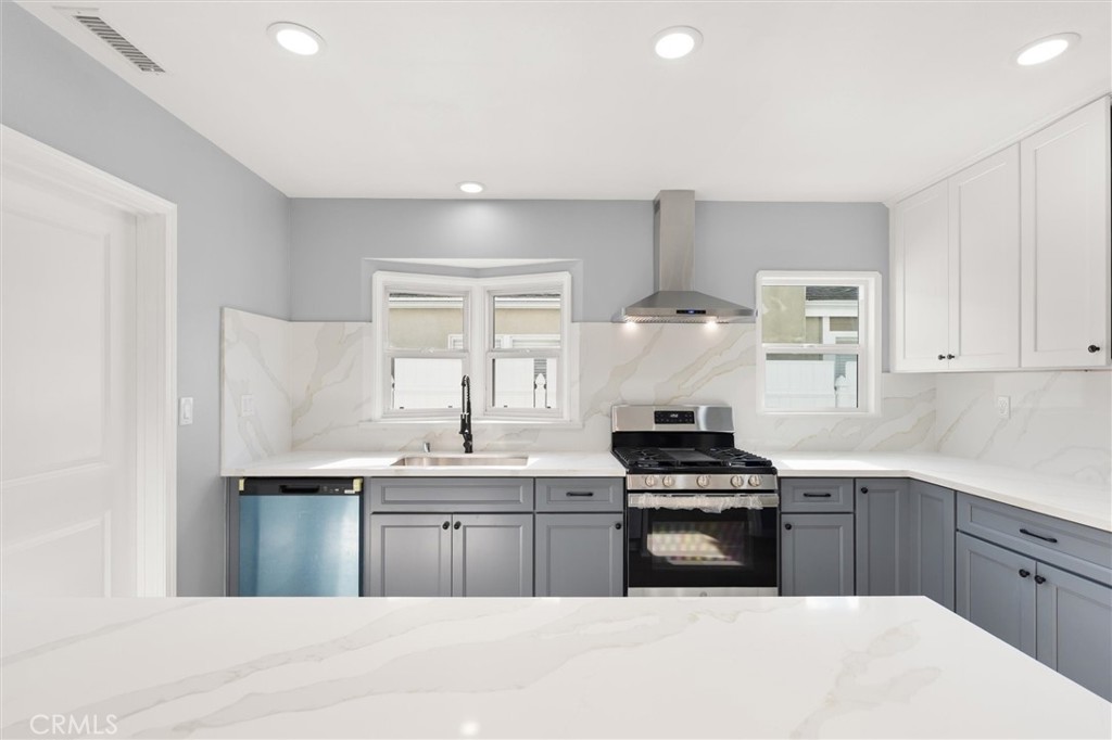 8460 Truxton Avenue Los Angeles, CA 90045 - Photo 12 of 41 a kitchen with a sink and cabinets