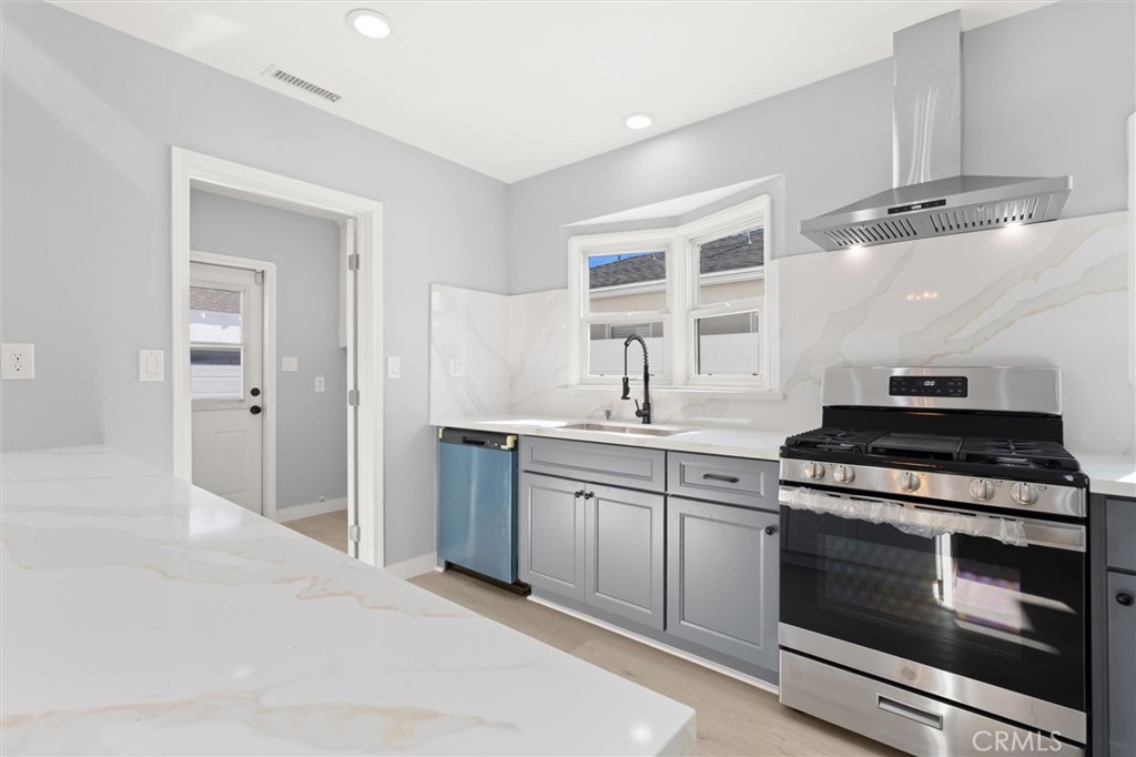 8460 Truxton Avenue Los Angeles, CA 90045 - Photo 14 of 41 a kitchen with a stove and a sink