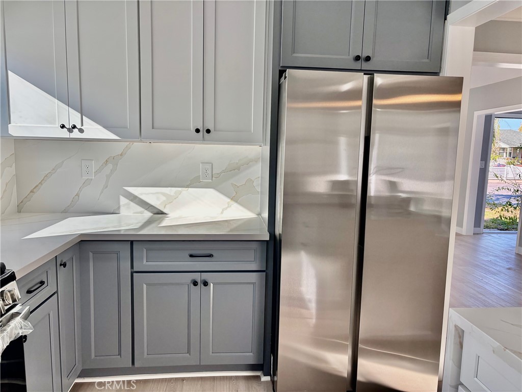 8460 Truxton Avenue Los Angeles, CA 90045 - Photo 15 of 41 a kitchen with a refrigerator and cabinets