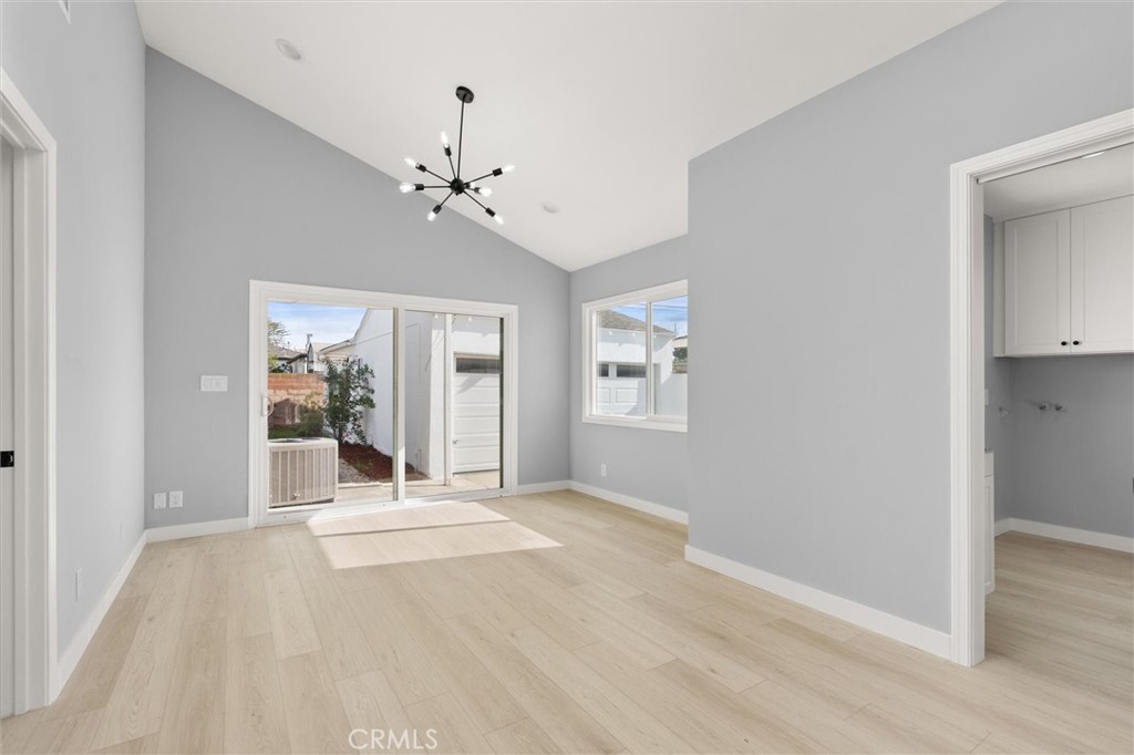 8460 Truxton Avenue Los Angeles, CA 90045 - Photo 20 of 41 a view of a livingroom with a chandelier fan and windows