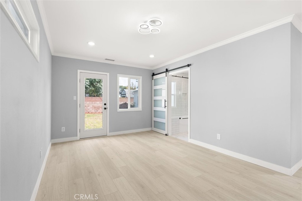 8460 Truxton Avenue Los Angeles, CA 90045 - Photo 23 of 41 an empty room with window and wooden floor