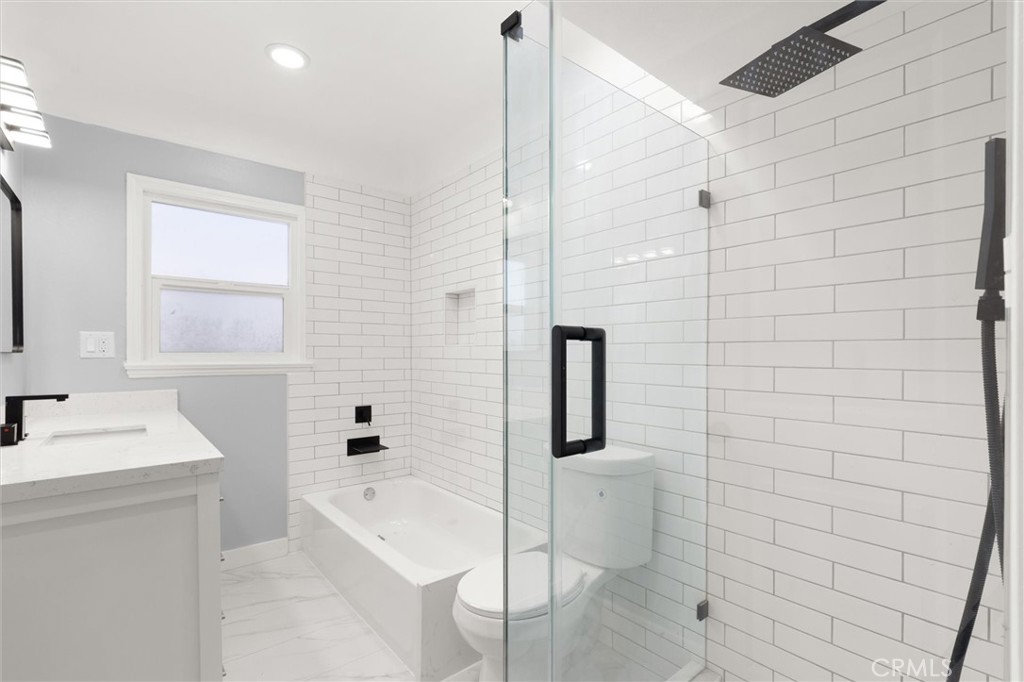 8460 Truxton Avenue Los Angeles, CA 90045 - Photo 29 of 41 a bathroom with a sink a toilet and shower