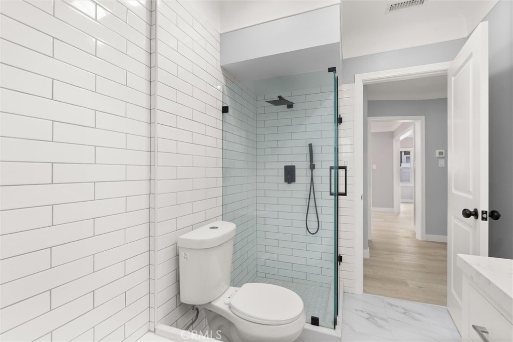 8460 Truxton Avenue Los Angeles, CA 90045 - Photo 30 of 41 a bathroom with a toilet and shower