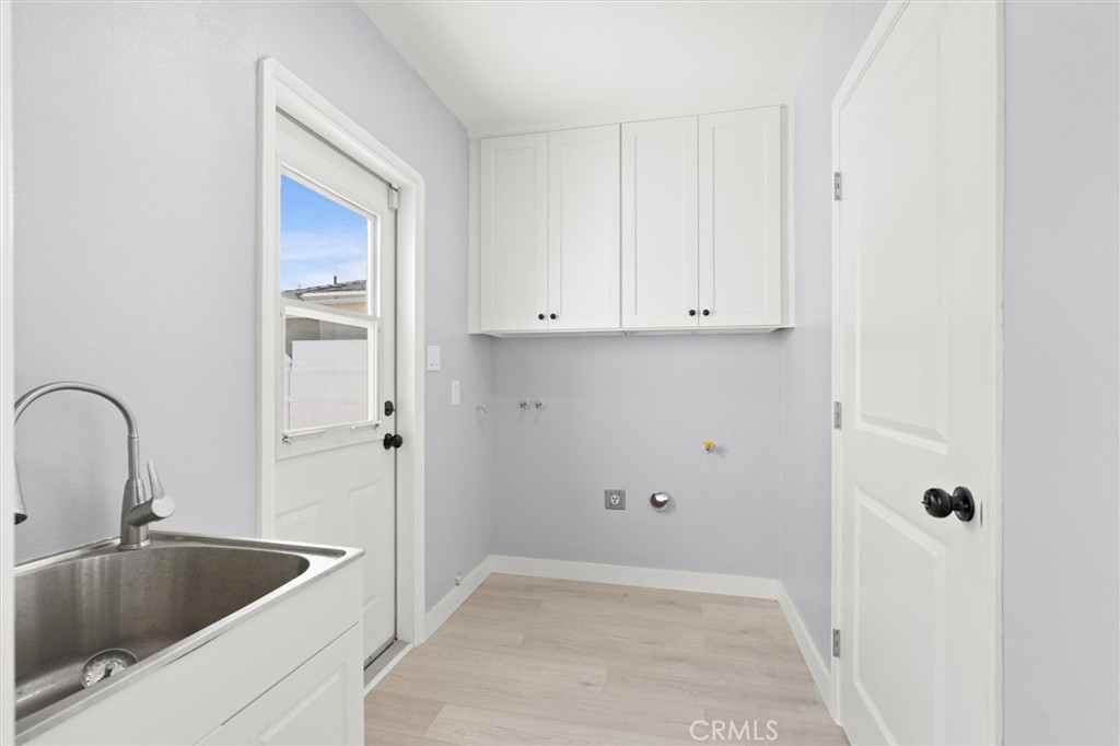 8460 Truxton Avenue Los Angeles, CA 90045 - Photo 33 of 41 a kitchen with a sink and cabinets