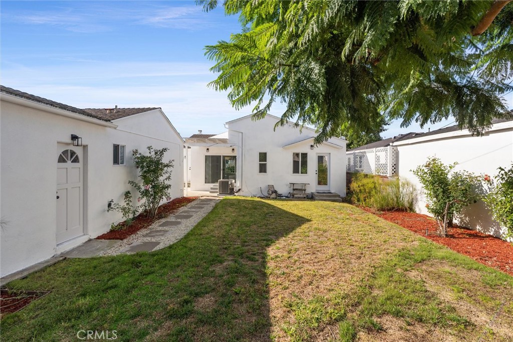 8460 Truxton Avenue Los Angeles, CA 90045 - Photo 34 of 41 a front view of a house with a garden