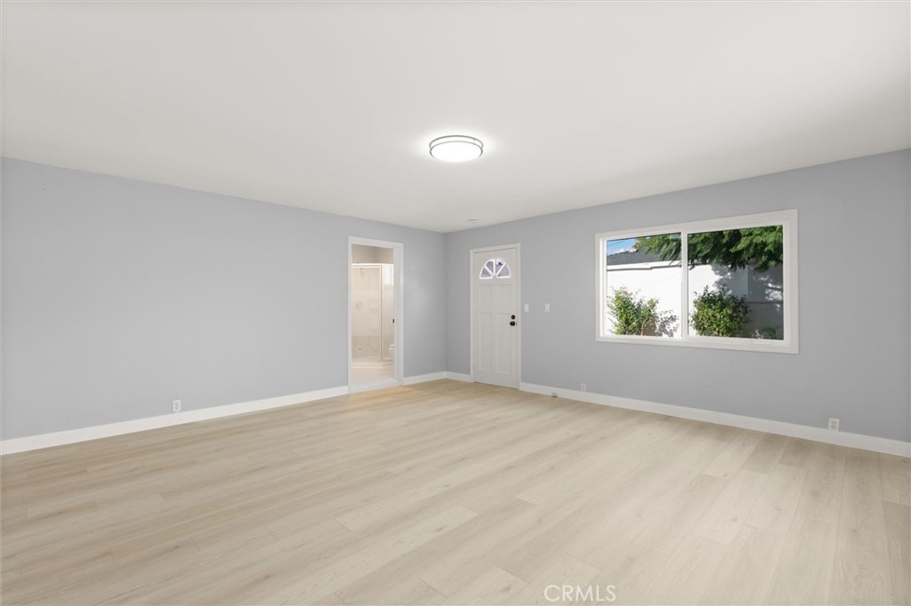8460 Truxton Avenue Los Angeles, CA 90045 - Photo 36 of 41 a view of an empty room with wooden floor and a window