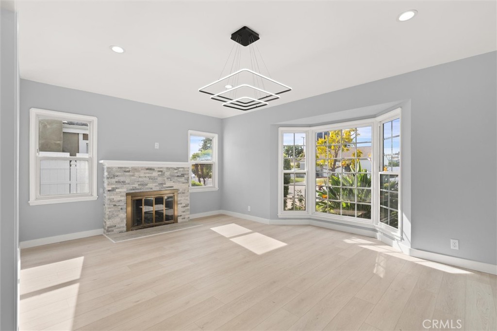 8460 Truxton Avenue Los Angeles, CA 90045 - Photo 5 of 41 a view of an empty room with window and fire place