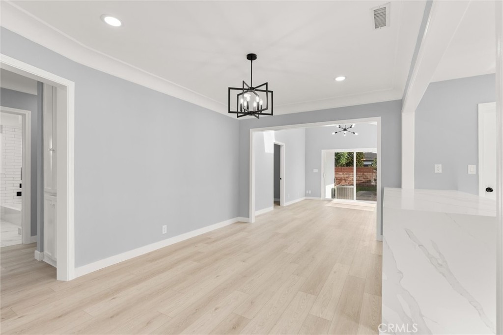 8460 Truxton Avenue Los Angeles, CA 90045 - Photo 7 of 41 a view of a room with wooden floor and windows