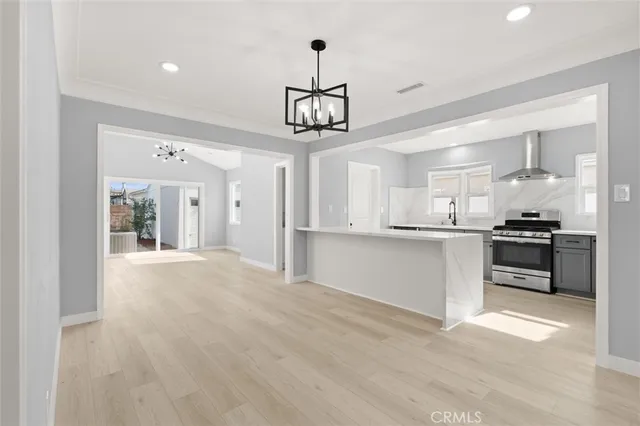 a view of kitchen with sink and cabinets