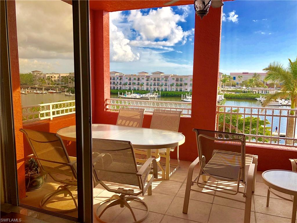 451 Bayfront Place, Unit 5311 Naples, FL 34102 - Photo 7 of 38 a dining room with furniture and a floor to ceiling window