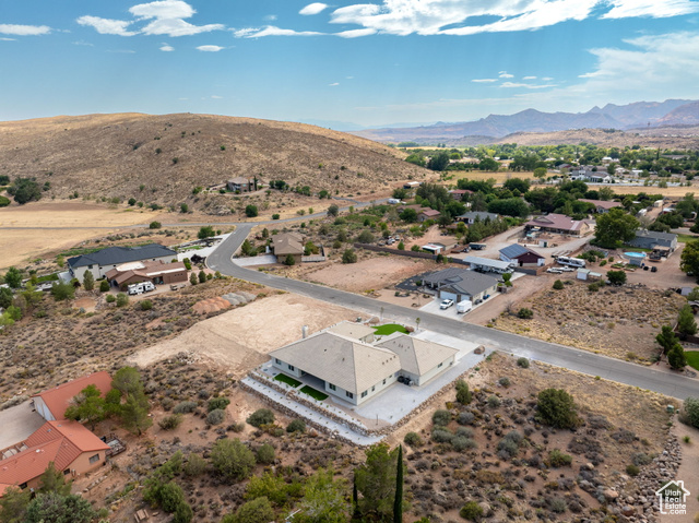 230 Boulder Way Leeds, UT 84746 - Photo 55 of 72 Aerial view of residential area featuring a desert landscape and a mountain backdrop