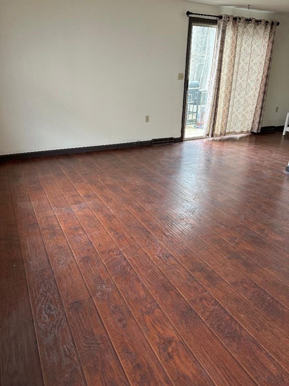 210 3rd Street Lowell, MA 01850 - Photo 15 of 18 a view of a livingroom with wooden floor