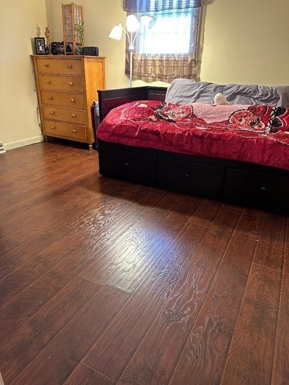 210 3rd Street Lowell, MA 01850 - Photo 18 of 18 a bedroom with a bed and a window