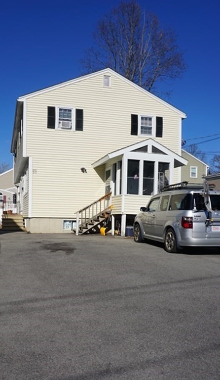 210 3rd Street Lowell, MA 01850 - Photo 2 of 18 a couple of cars parked in front of a house