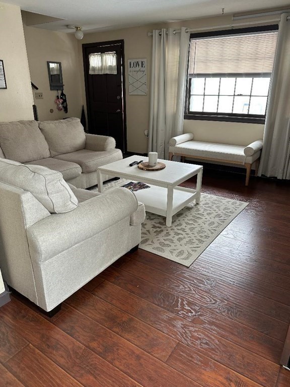 210 3rd Street Lowell, MA 01850 - Photo 4 of 18 a living room with furniture and a large window