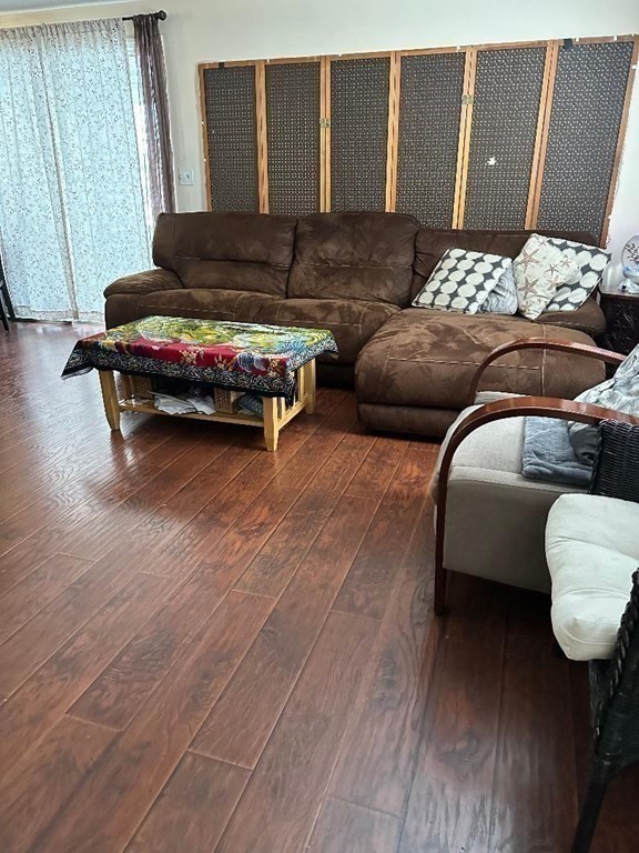 210 3rd Street Lowell, MA 01850 - Photo 5 of 18 a livingroom with furniture and wooden floor