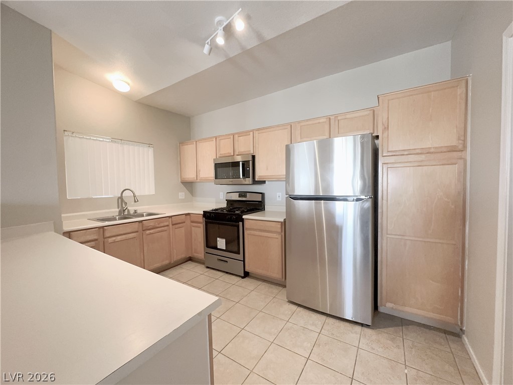8725 West Flamingo Road, Unit 208 Las Vegas, NV 89147 - Photo 4 of 16 This functional kitchen features ample counter space and essential appliances, perfect for everyday living.