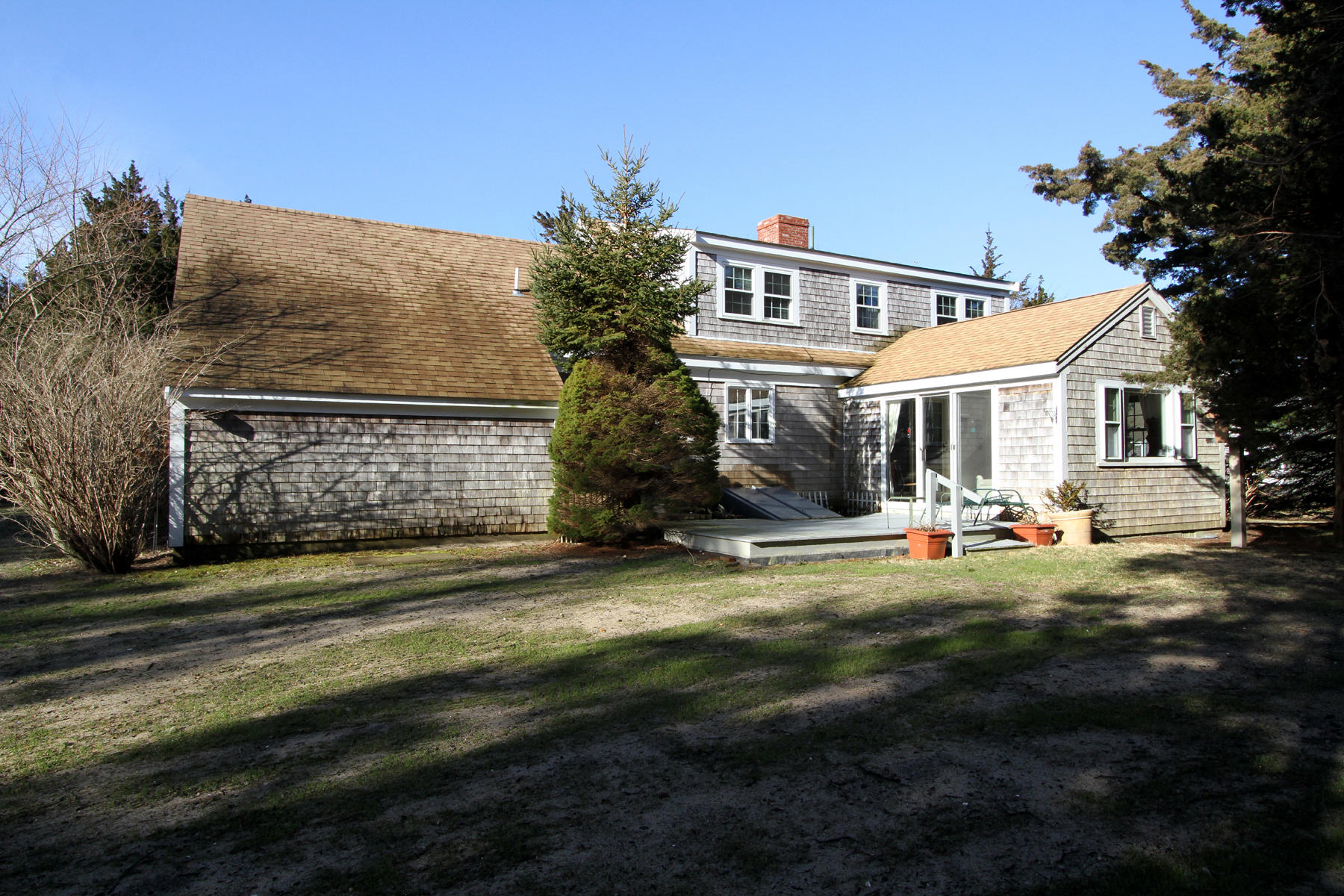 16 Seavers Road Orleans, MA 02653 - Photo 14 of 23 a view of a house with backyard porch and sitting area