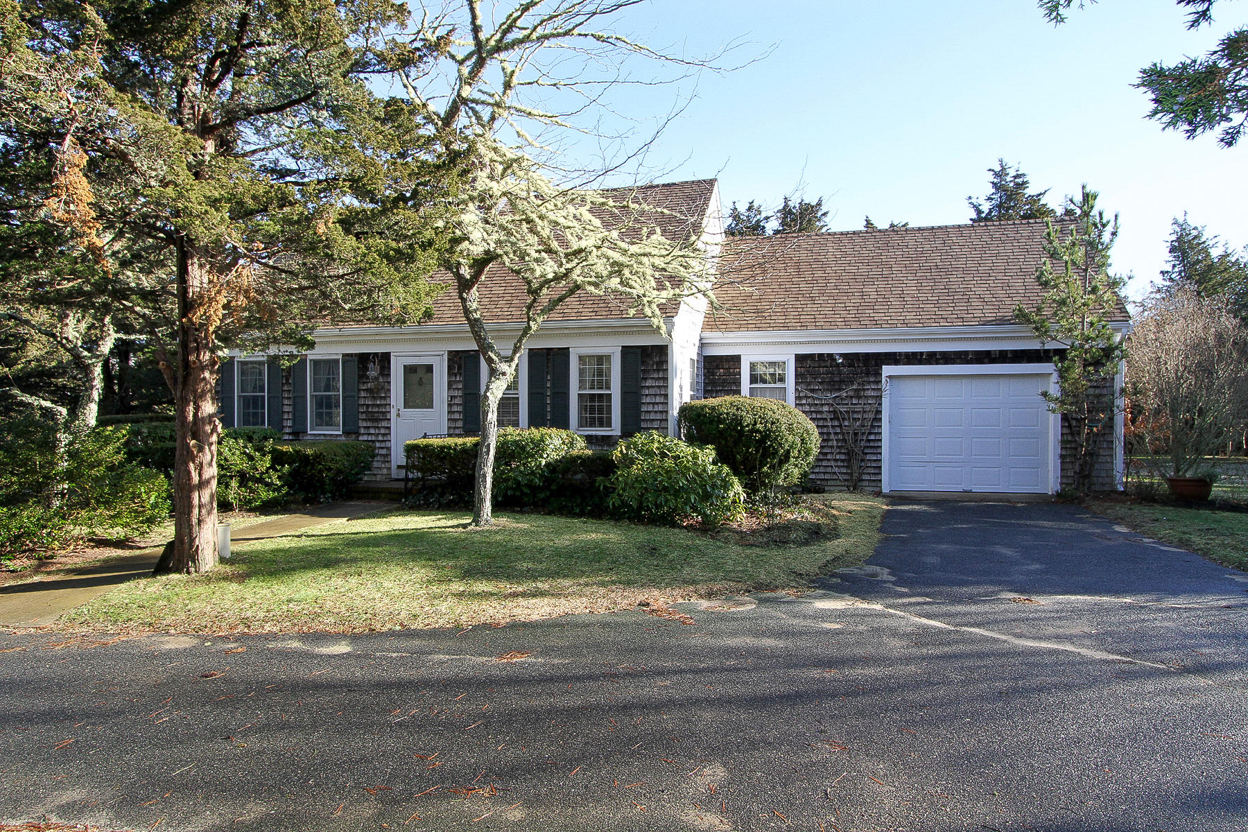 16 Seavers Road Orleans, MA 02653 - Photo 16 of 23 front view of a house with a yard