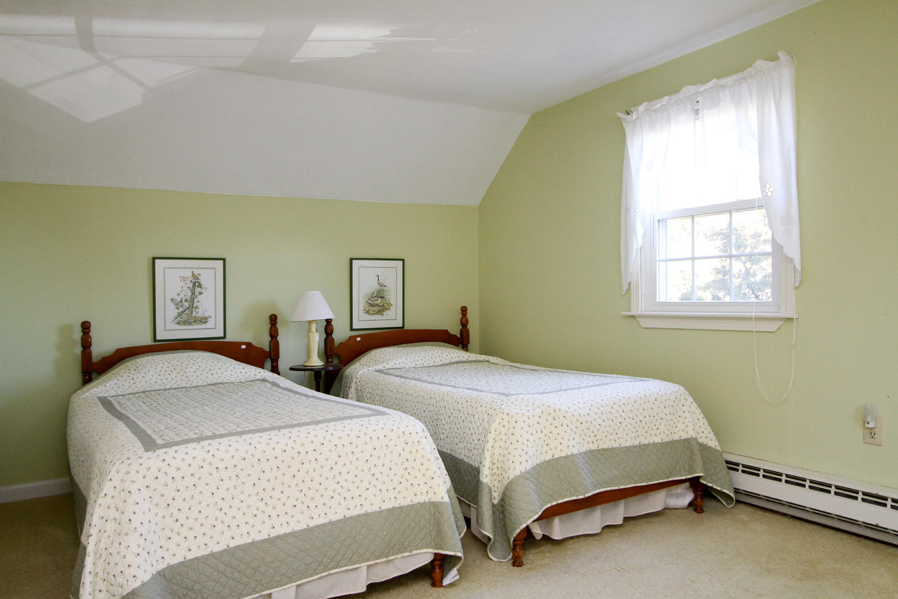 16 Seavers Road Orleans, MA 02653 - Photo 9 of 23 a bedroom with two beds and a window