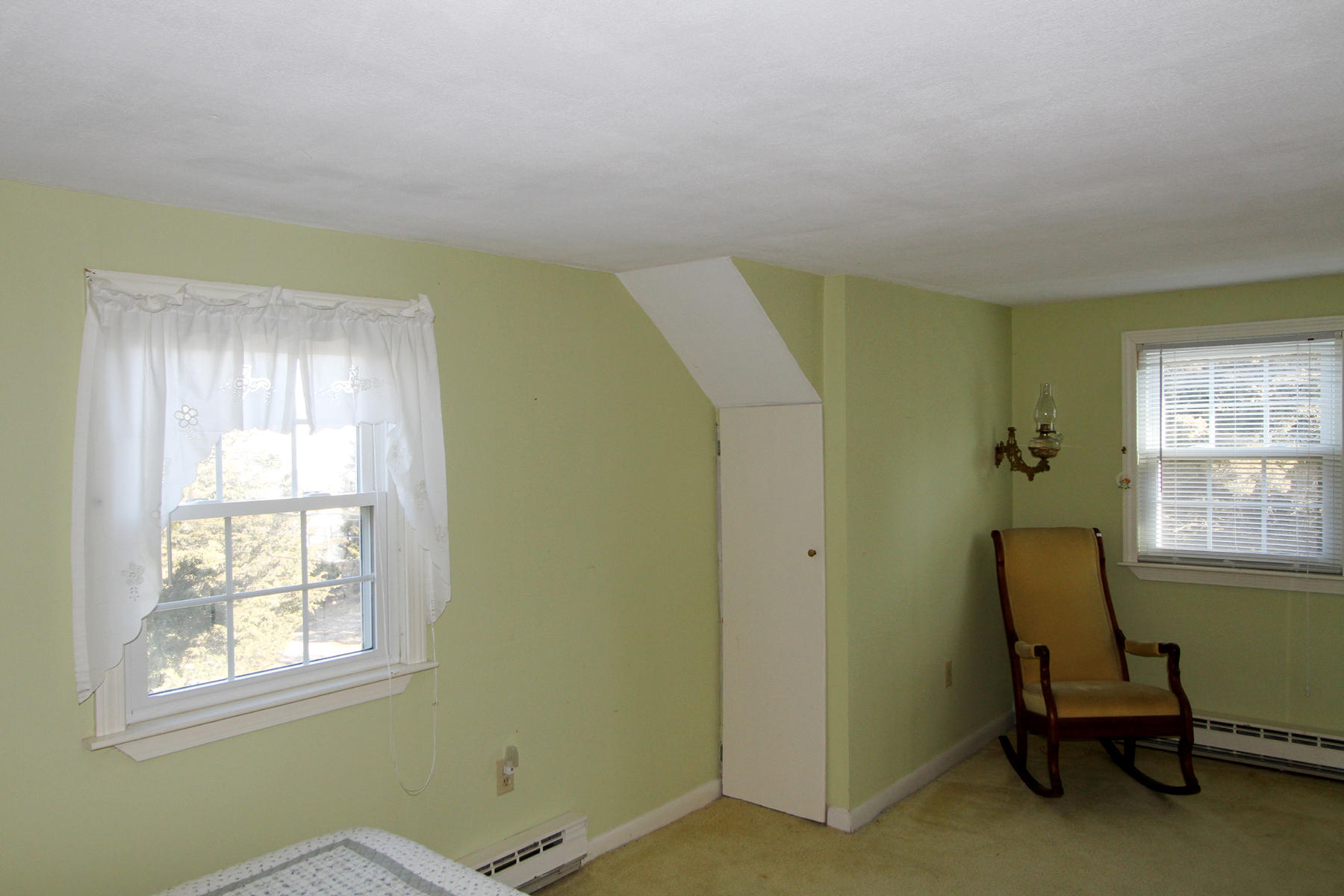 16 Seavers Road Orleans, MA 02653 - Photo 10 of 23 a room with a window and a chair