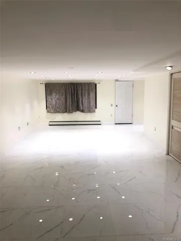 a view of a room with an empty space