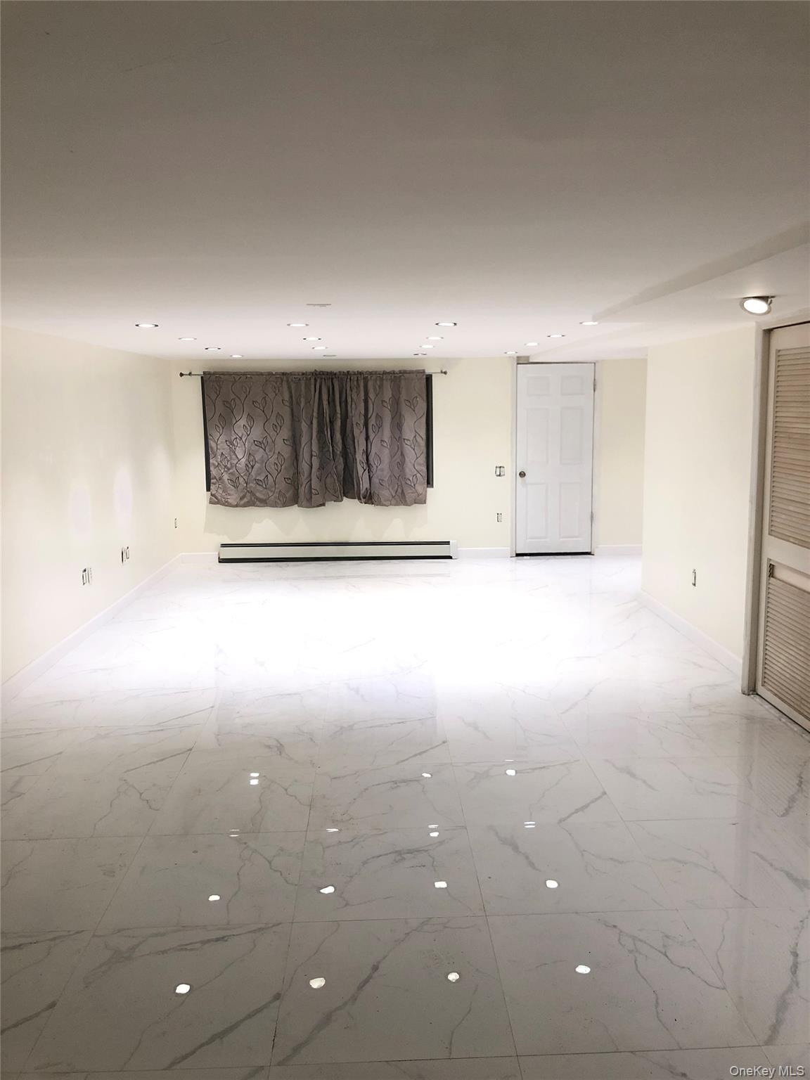 148-03 Horace Harding Expressway Queens, NY 11367 - Photo 13 of 18 a view of a room with an empty space