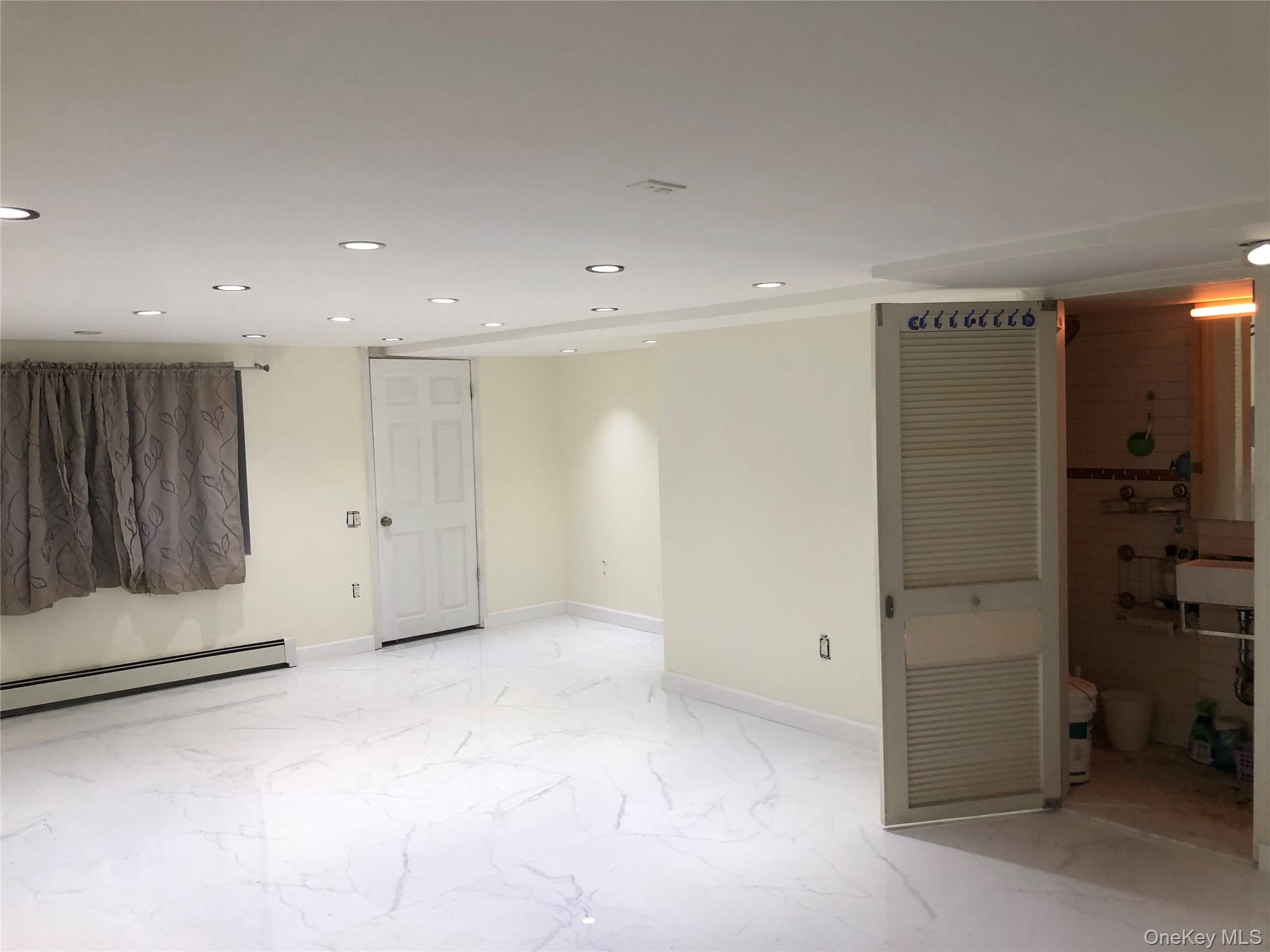 148-03 Horace Harding Expressway Queens, NY 11367 - Photo 14 of 18 a view of an empty room