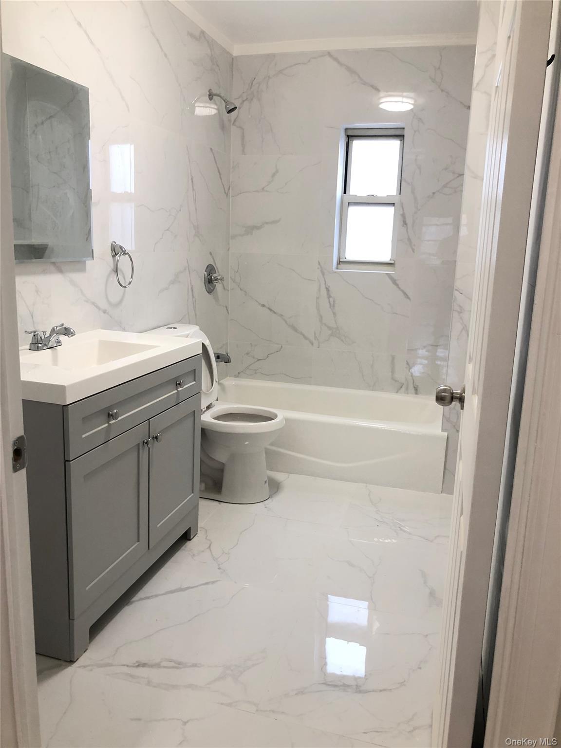 148-03 Horace Harding Expressway Queens, NY 11367 - Photo 15 of 18 a bathroom with a sink a toilet and shower