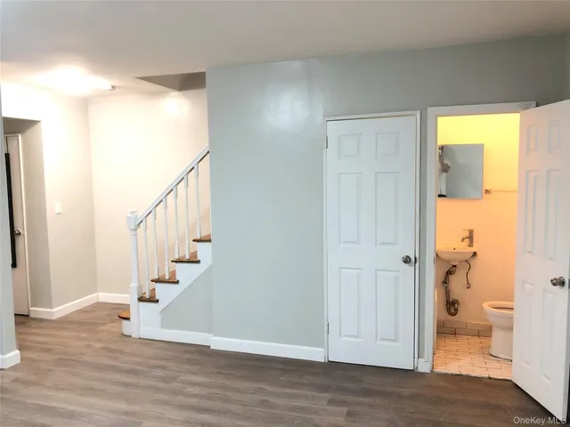 a view of entryway with wooden floor and door