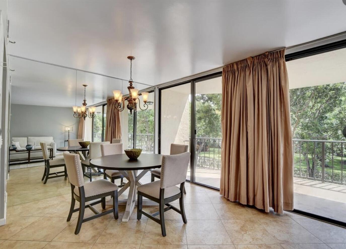 859 Jeffery Street, Unit 3030 Boca Raton, FL 33487 - Photo 6 of 24 a dining room with furniture and window