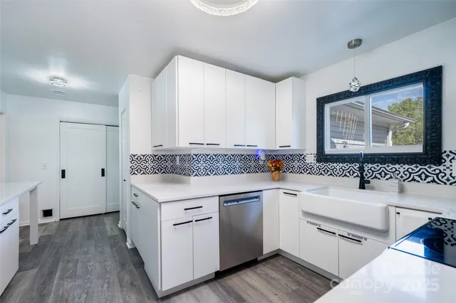 a kitchen with a sink stove and cabinets