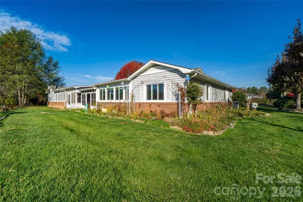 swimming pool view with a garden space