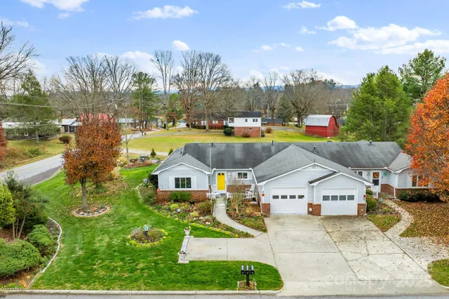 a aerial view of a house with a yard