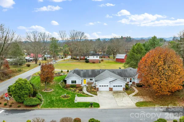 a aerial view of a house with a yard