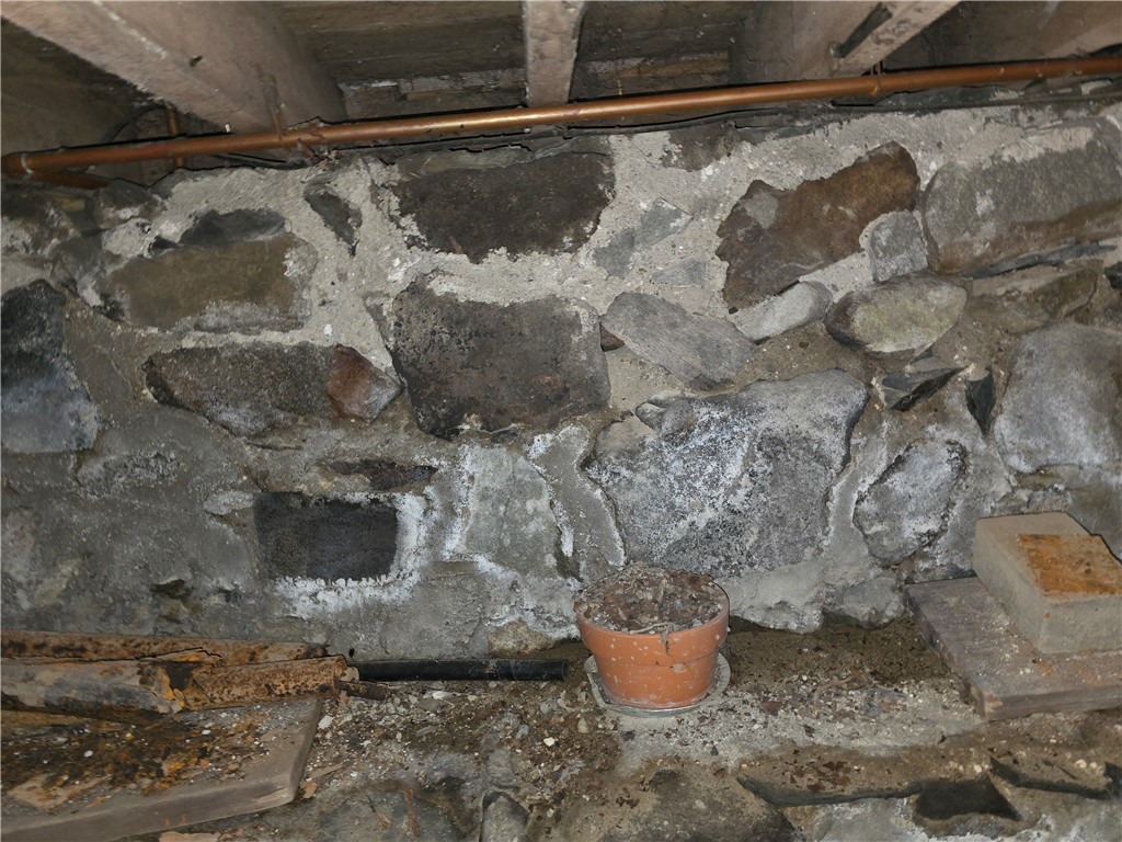 457 Wolf Road West Alexandria, OH 45381 - Photo 27 of 28 View a robust stone foundation, showcasing the home's enduring construction.