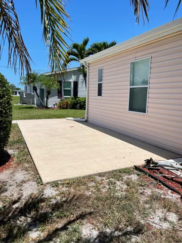 a view of a house with a yard and garage