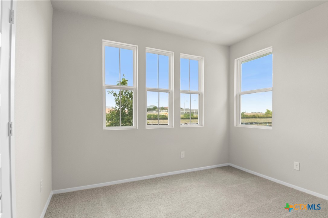 3035 Winding Creek Road Kyle, TX 78640 - Photo 16 of 38 a view of an empty room with a window