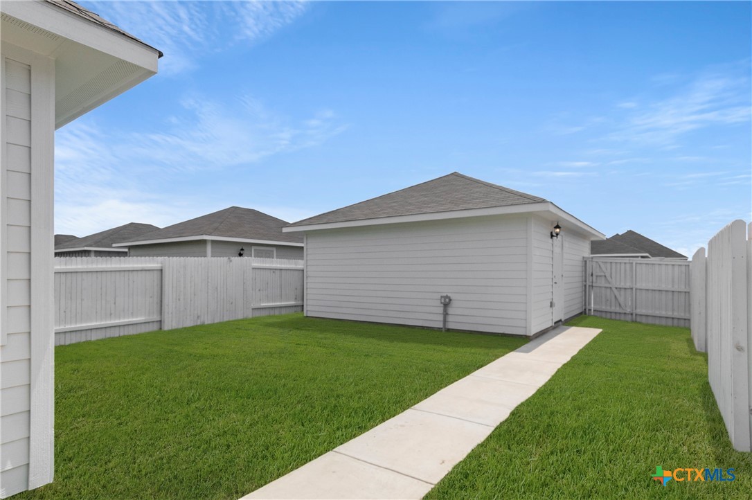 3035 Winding Creek Road Kyle, TX 78640 - Photo 19 of 38 a view of a back yard of the house