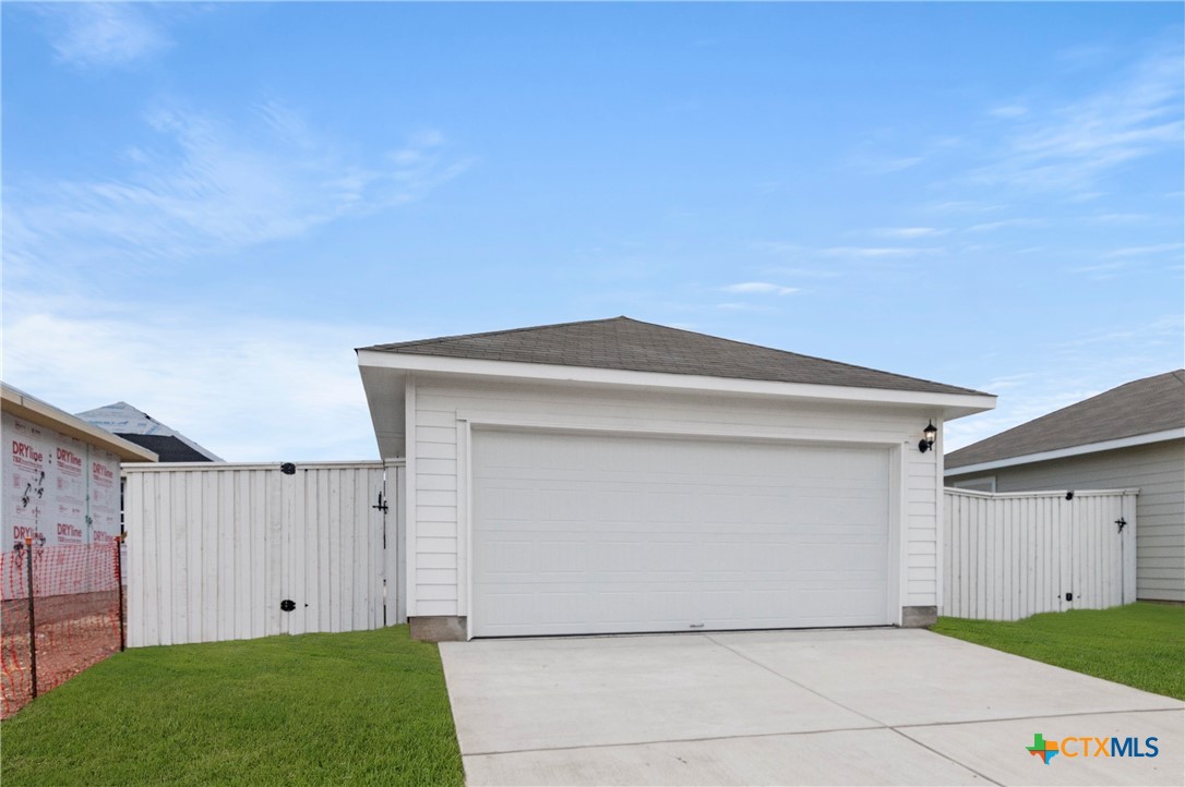 3035 Winding Creek Road Kyle, TX 78640 - Photo 21 of 38 a view of white house with a garage
